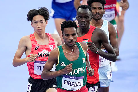 Samuel Firewu, Ryuji Miura, Abraham Kibiwot, and Avinash Mukund Sable compete in 3000 meters steeplechase
